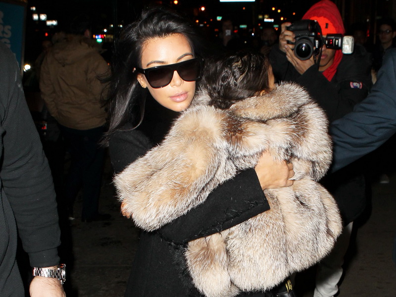 kim-kardashian-with-nori-who-is-wearing-a-huge-fur-2.bin