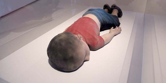 A sculpture created by Finnish artist Pekka Jylha portraying drowned Syrian refugee Alan Kurdi, is seen on display at the Helsinki Contemporary gallery in Helsinki, Finland March 3, 2016. Jylha's exhibition 