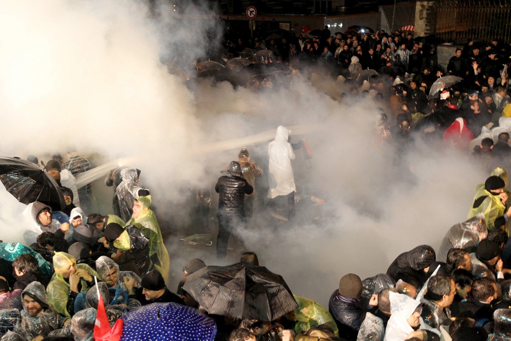 Riot police use tear gas to disperse protesting employees and supporters of Zaman newspaper in front of its headquarters in Istanbul, Turkey, early March 5, 2016. Turkish authorities seized control of the country's largest newspaper on Friday in a widening crackdown against supporters of U.S.-based Muslim cleric Fethullah Gulen, an influential foe of President Tayyip Erdogan. REUTERS/Turgut Engin/Zaman Daily EDITORIAL USE ONLY. NO RESALES. NO ARCHIVE        