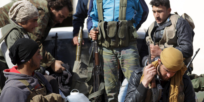 Rebel fighters from 'Jaysh al-Sunna' gather for a change of guards in Tel Mamo village, in the southern countryside of Aleppo, Syria March 6, 2016. REUTERS/Khalil Ashawi