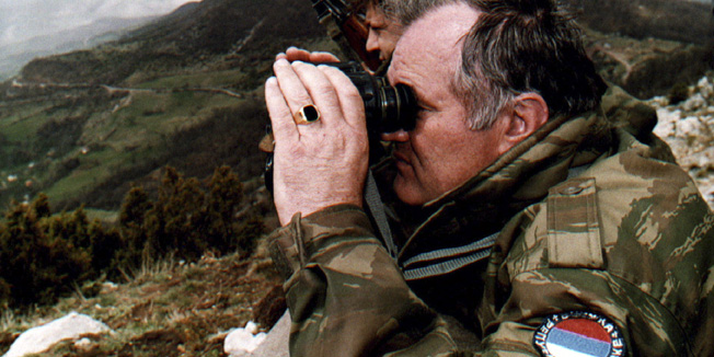 Bosnian Serb army commander Ratko Mladic monitors a battle against Moslem forces from his shelter on the top of a hill some 4 km from from the center of eastern Bosnian Gorazde April 16, 1994. - RTXFE1A