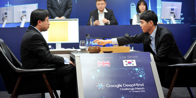 Go player Lee Sedol (R), puts the first stone against Google's artificial intelligence program AlphaGo as Google DeepMind's lead programmer Aja Huang (L) looks on during the Google DeepMind Challenge Match in Seoul, South Korea, in this handout picture provided by Korea Baduk Assosication and released by News1 on March 9, 2016.  REUTERS/Korea Baduk Association/News1ATTENTION EDITORS - FOR EDITORIAL USE ONLY. NOT FOR SALE FOR MARKETING OR ADVERTISING CAMPAIGNS. THIS IMAGE HAS BEEN SUPPLIED BY A THIRD PARTY. IT IS DISTRIBUTED, EXACTLY AS RECEIVED BY REUTERS, AS A SERVICE TO CLIENTS. SOUTH KOREA OUT. NO COMMERCIAL OR EDITORIAL SALES IN SOUTH KOREA. NO RESALES. NO ARCHIVE.
