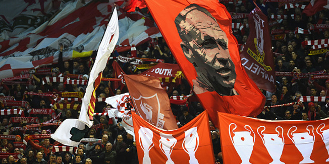 LIVERPOOL, ENGLAND - MARCH 10:  Liverpool fans wave flags and banners prior to the UEFA Europa League Round of 16 first leg match between Liverpool and Manchester United at Anfield on March 10, 2016 in Liverpool, United Kingdom.  (Photo by Laurence Griffiths/Getty Images)