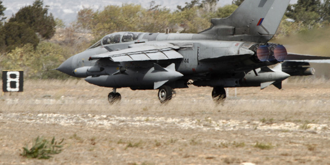 A British Tornado jet prepares to takeoff at the RAF Akrotiri in Cyprus September 27, 2014. Britain's parliament approved air strikes against Islamic State (IS) insurgents in Iraq by a decisive margin on Friday, paving the way for the Royal Air Force to join U.S.-led military action with immediate effect. Six Cyprus-based Tornado GR4 fighter-bombers were on standby to take part in initial sorties after Prime Minister David Cameron recalled parliament from recess to back military action following a formal request from the Iraqi government.   REUTERS/Stringer   (CYPRUS - Tags: POLITICS TRANSPORT CIVIL UNREST MILITARY) - RTR47XBE