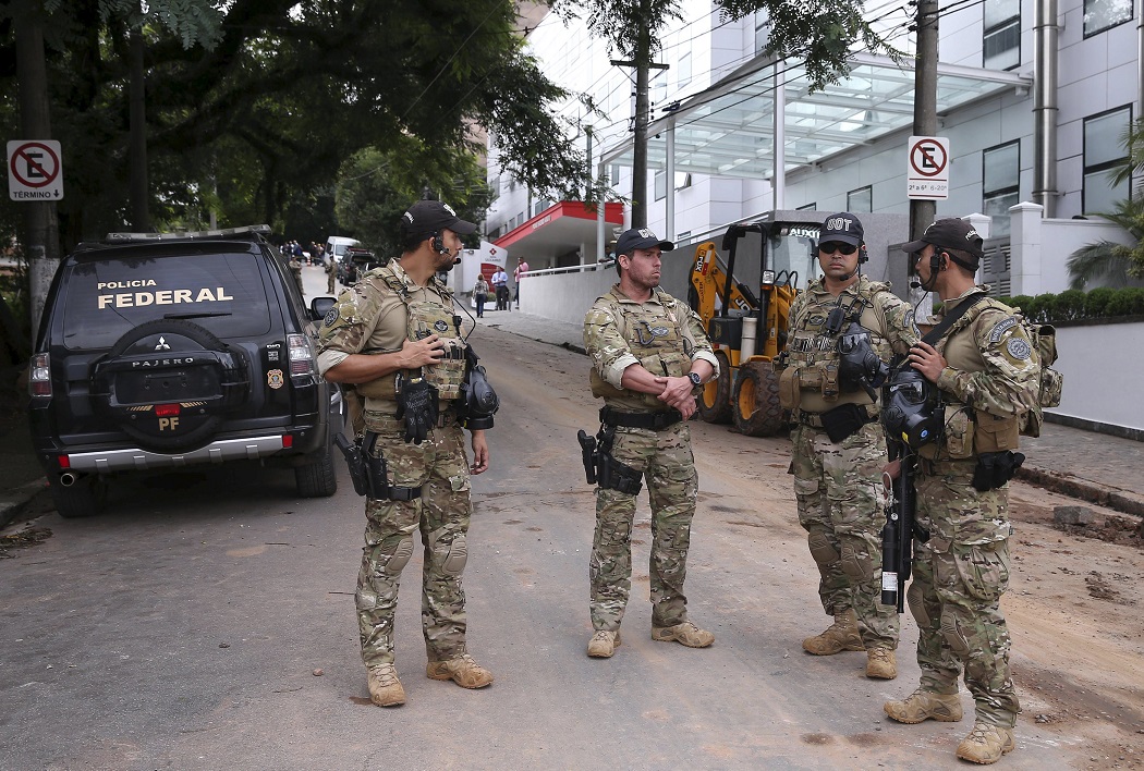 Federal police officers stand in front of the office of former Brazil's President Luiz Inacio Lula da Silva, called 