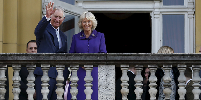 Britain's Prince Charles waves to the people with his wife Camilla, Duchess of Cornwall, as they stand on a balcony at the Croatian National Theatre in Zagreb March 14, 2016. REUTERS/Antonio Bronic - RTX29485