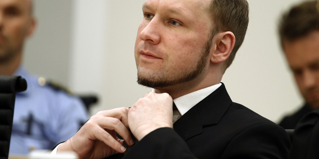 Norwegian mass killer Anders Behring Breivik adjusts his tie as the Oslo Court delivered the verdict of his trial in Oslo Courthouse August 24, 2012. Breivik was jailed for a maximum term on Friday when judges declared him sane enough to answer for the murder of 77 people last year, drawing a smirk of triumph from the self-styled warrior against Islam. REUTERS/Heiko Junge/NTB Scanpix/Pool (NORWAY - Tags: CRIME LAW) - RTR3739M