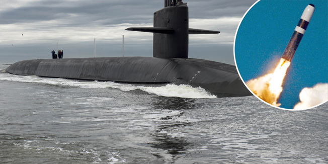 The Ohio-class ballistic missile submarine USS Tennessee returns to Naval Submarine Base Kings Bay, Georgia in this February 6, 2013 handout photo. The Tennessee and 13 other Ohio-class submarines are critical elements of the U.S. nuclear deterrent but the oldest has been in service for 33 years and the end of the fleet's useful life of 42 years is in sight.     Every nuclear weapons delivery system in the U.S. arsenal ? the so-called triad of bombers, ballistic missiles and submarines ? will have to be replaced in the coming 30 years.  REUTERS/Mass Communication Specialist 1st Class James Kimber/U.S. Navy/Handout via Reuters  (UNITED STATES) - Tags: MILITARY POLITICS) THIS IMAGE HAS BEEN SUPPLIED BY A THIRD PARTY. IT IS DISTRIBUTED, EXACTLY AS RECEIVED BY REUTERS, AS A SERVICE TO CLIENTS. FOR EDITORIAL USE ONLY. NOT FOR SALE FOR MARKETING OR ADVERTISING CAMPAIGNS - RTR4AV1U