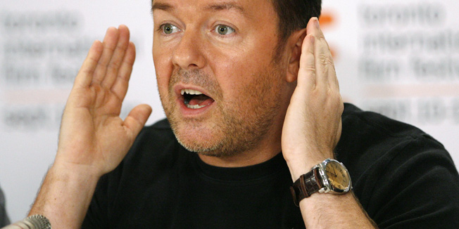Director, writer and producer Ricky Gervais gestures as he pretends to play peek-a-boo at a news conference for 