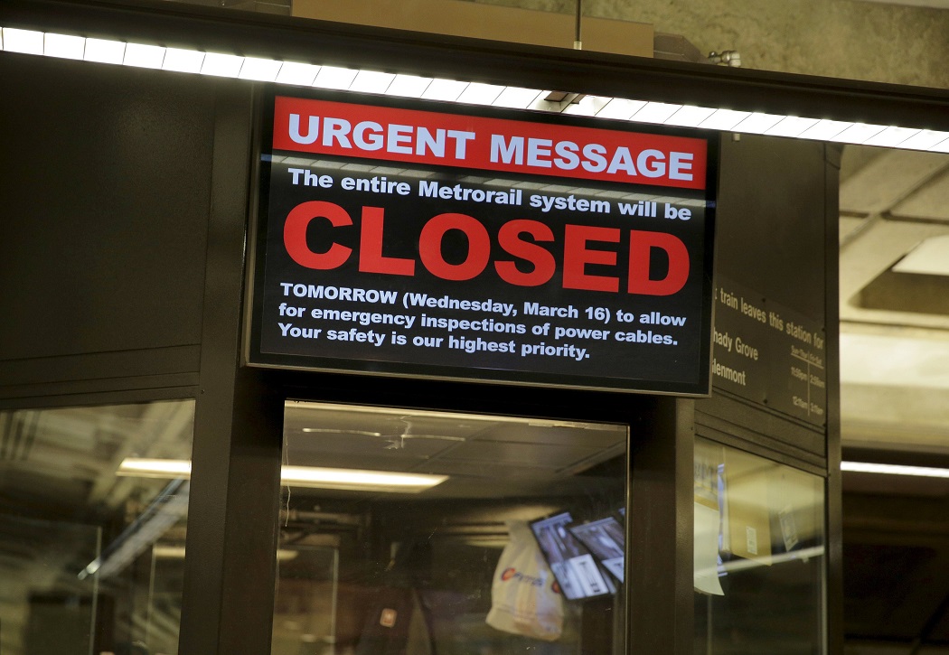 A sign announces a 29-hour shutdown for an emergency safety investigation of power cabling of the entire Washington Metro system in Washington March 15, 2016.      REUTERS/Joshua Roberts