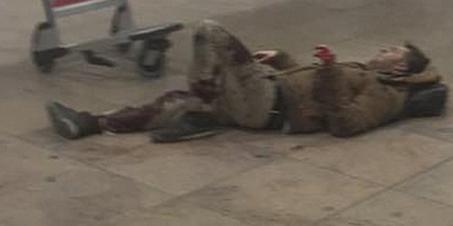 ATTENTION EDITORS - VISUAL COVERAGE OF SCENES OF INJURY OR DEATH   An injured man lies at the scene of explosions at Zaventem airport near Brussels, Belgium, March 22, 2016. REUTERS/Ketevan Kardava/Courtesy of 1tv.ge/Handout via Reuters     ATTENTION EDITORS - THIS IMAGE HAS BEEN SUPPLIED BY A THIRD PARTY. REUTERS IS UNABLE TO INDEPENDENTLY VERIFY THE AUTHENTICITY, CONTENT, LOCATION OR DATE OF THIS IMAGE. FOR EDITORIAL USE ONLY. NOT FOR SALE FOR MARKETING OR ADVERTISING CAMPAIGNS. FOR EDITORIAL USE ONLY. NO RESALES. NO ARCHIVE. MANDATORY CREDIT. THIS PICTURE WAS PROCESSED BY REUTERS TO ENHANCE QUALITY. AN UNPROCESSED VERSION WILL BE PROVIDED SEPARATELY. TEMPLATE OUT