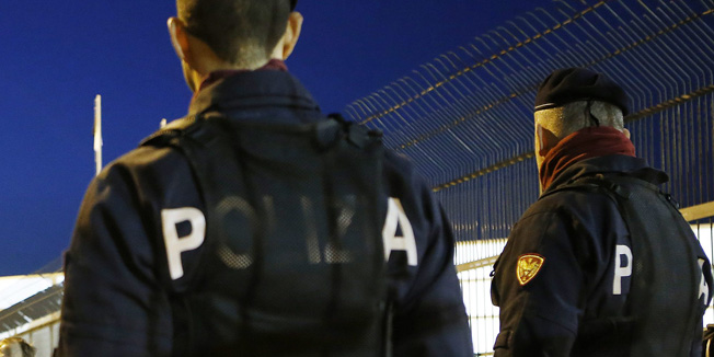 Football soccer - Italy v Spain - International friendly match - Friuli stadium , Udine, Italy - 24/03/16 Stewards  perform security checks as police officers watch before the start of the match. REUTERS/Alessandro Garofalo
