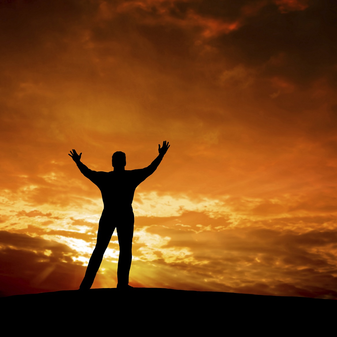 reverent man in silhouette at dusk, square frame