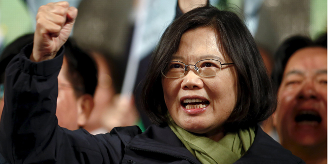 Democratic Progressive Party (DPP) Chairperson and presidential candidate Tsai Ing-wen shouts slogans as she greets supporters after her election victory at party headquarters in Taipei, Taiwan January 16, 2016. REUTERS/Pichi Chuang