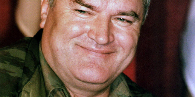 Bosnian Serb Army commander General Ratko Mladic smiles during a news conference in the northern Bosnian town of Banja Luka September 26 - RTXFPAB