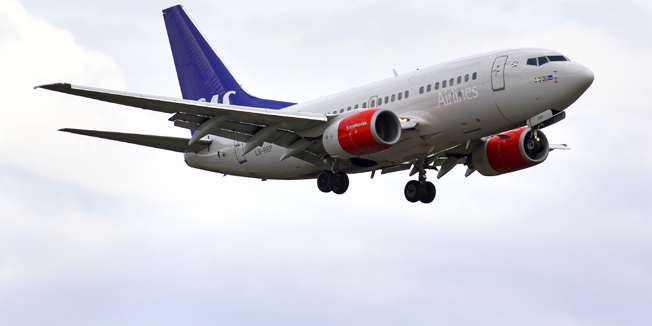BERLIN, GERMANY - AUGUST 17, 2014: SAS Scandinavian Airlines Boeing 737 arrives to the Tegel International Airport.