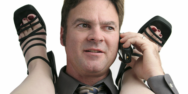A man having an office affair, interrupted by the telephone.