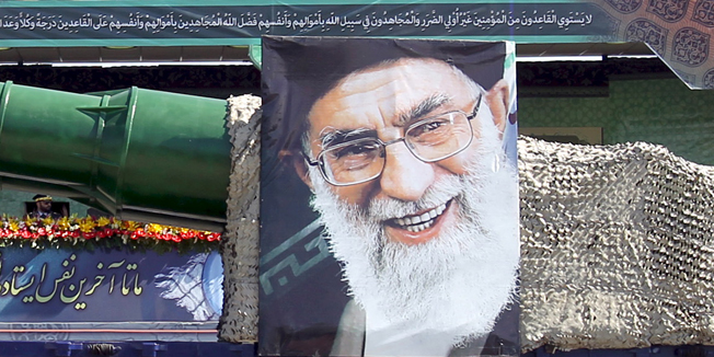 A military truck carrying a missile and a picture of Iran's Supreme Leader Ayatollah Ali Khamenei is seen during a parade marking the anniversary of the Iran-Iraq war (1980-88), in Tehran September 22, 2015. REUTERS/Raheb Homavandi/TIMAATTENTION EDITORS - THIS PICTURE WAS PROVIDED BY A THIRD PARTY. REUTERS IS UNABLE TO INDEPENDENTLY VERIFY THE AUTHENTICITY, CONTENT, LOCATION OR DATE OF THIS IMAGE. FOR EDITORIAL USE ONLY. NOT FOR SALE FOR MARKETING OR ADVERTISING CAMPAIGNS. NO THIRD PARTY SALES. NOT FOR USE BY REUTERS THIRD PARTY DISTRIBUTORS. THIS PICTURE IS DISTRIBUTED EXACTLY AS RECEIVED BY REUTERS, AS A SERVICE TO CLIENTS. - RTX1RU62