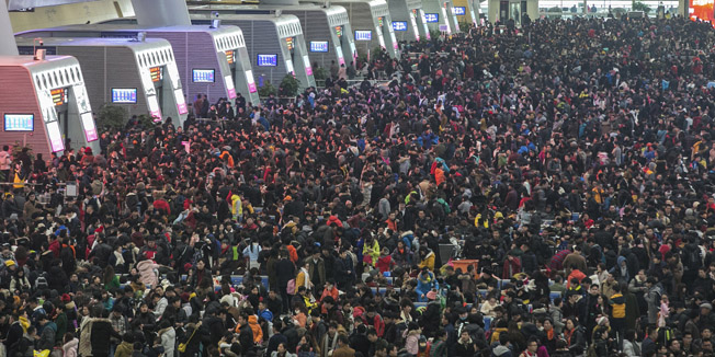 REFILE - CORRECTING BYLINE     Passengers crowd at the waiting hall inside a railway station after trains were delayed due to heavy snow, during the travel rush ahead of the upcoming Spring Festival, in Hangzhou, Zhejiang province, February 1, 2016. REUTERS/Stringer  ATTENTION EDITORS - THIS PICTURE WAS PROVIDED BY A THIRD PARTY. THIS PICTURE IS DISTRIBUTED EXACTLY AS RECEIVED BY REUTERS, AS A SERVICE TO CLIENTS. CHINA OUT. NO COMMERCIAL OR EDITORIAL SALES IN CHINA.