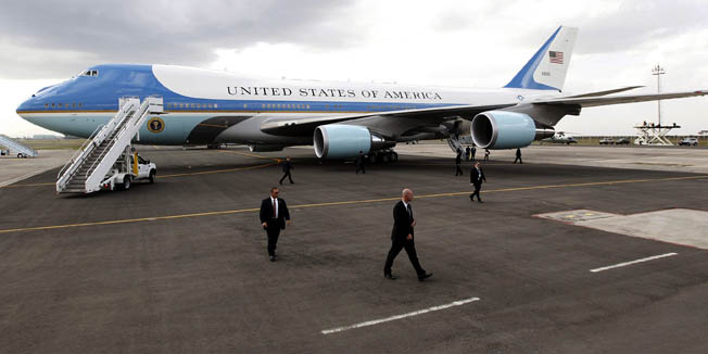 U.S. Secret Service agents walk around Air Force One as it waits to take off to take U.S. President Barack Obama from Kenya's Jomo Kenyatta International Airport in Nairobi, in this file photo taken July 26, 2015. Boeing Co has won a contract to start preliminary design work on a new fleet of Air Force One presidential aircraft based on its 747-8 commercial airliner, the Pentagon said on Friday. REUTERS/Thomas Mukoya/Files