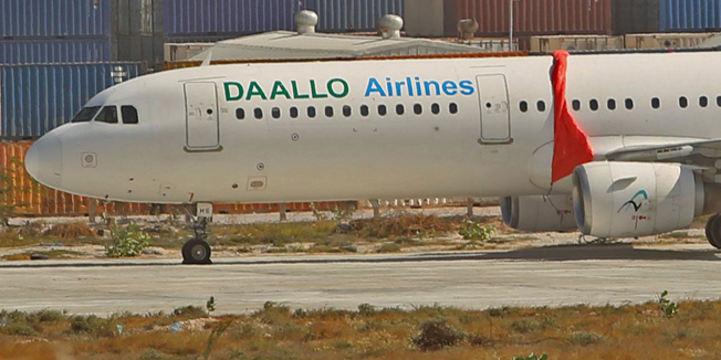 An aircraft belonging to Daallo Airlines is parked at the Aden Abdulle international airport after making an emergency landing following an explosion inside the plane in Somalia's capital Mogadishu, February 3, 2016. Investigators believe a bomb likely caused the explosion aboard a plane that was forced to return to the Somali capital of Mogadishu for an emergency landing on Tuesday, two U.S. government sources said on Wednesday. REUTERS/Feisal Omar
