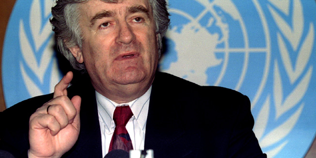 Bosnian Serb leader Radovan Karadzic gestures during press conference after a new round of peace talks on Bosnia, in the U N Offices of Geneva, February 12 - RTXFGTO