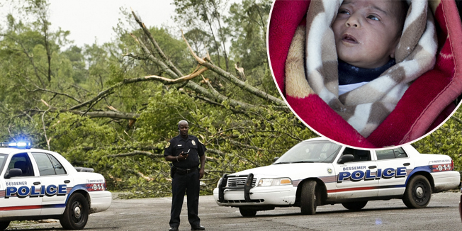 Police direct traffic around fallen trees and damaged homes after a tornado hit Bessemer April 29, 2014. At least 30 people across six states have been killed by a vicious storm system that unleashed dozens of tornadoes and was threatening to cause more damage in heavily populated regions of the U.S. South on Tuesday.     REUTERS/Marvin Gentry (UNITED STATES - Tags: ENVIRONMENT DISASTER) - RTR3N49Y
