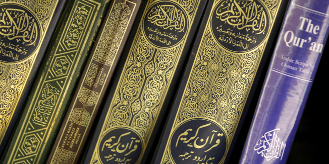 Copies of the Quran rest on a book shelf during Friday prayer service at the All Dulles Area Muslim Society in Sterling, Virginia, December 18, 2015. REUTERS/Joshua Roberts - RTX1ZBL3