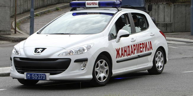 A convoy of police vehicles carrying Goran Hadzic leaves the Special Court in Belgrade July 22, 2011. Hadzic, a wartime leader of Croatia's Serbs, faces charges at the Hague court of crimes against humanity committed during the 1991-95 war in Croatia. Serbian security officials arrested Hadzic on a forest road in the Fruska Gora national park region about 65 km (40 miles) north of Belgrade.   REUTERS/Ivan Milutinovic  (SERBIA - Tags: CIVIL UNREST CRIME LAW CONFLICT) - RTR2P5CX