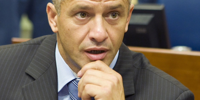 Bosnian Muslim Naser Oric sits in the courtroom of the International Criminal Tribunal for the former Yugoslavia (ICTY) as he waits for the judgement on an appeal filed by him in The Hague July 3, 2008. Oric, wartime commander of Srebrenica, was found guilty of failing to prevent the murder of Serbs and given a two-year sentence. REUTERS/Zoran Lesic/Pool  (NETHERLANDS) - RTX7L08