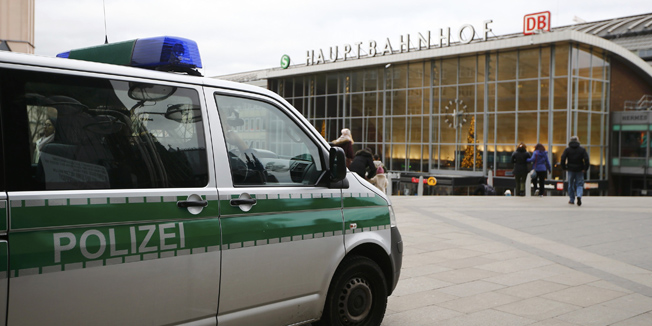 A police vehicle patrols at the main square and in front of the central railway station in Cologne, Germany, January 5, 2016. A mass attack by about 1,000 men, described by witnesses as being of North African appearance, on women celebrating New Year in the city of Cologne has caused outrage across Germany. Police say some 60 women have reported being robbed, threatened or sexually molested at the New Year's celebrations outside the twin-spired cathedral in Cologne by young, mostly drunk, men. There is also one allegation of rape.    REUTERS/Wolfgang Rattay 