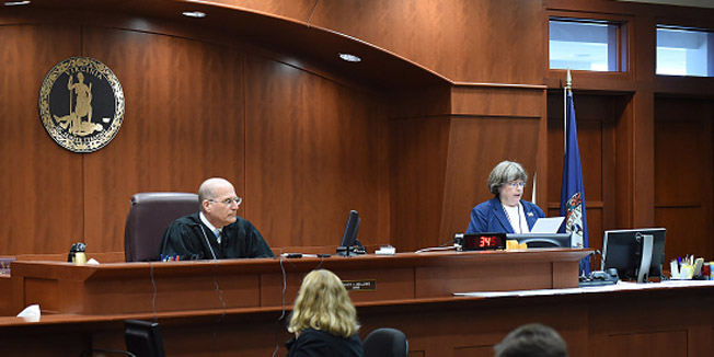 FAIRFAX, VA - NOVEMBER 02: Judge Randy I. Bellows sits at left as court clerk, Claire Scerra, right, reads the jury's verdict during the Charles Severance trial in Fairfax County Circuit Court on Monday November 02, 2015 in Fairfax, VA. Severance was found guilty of three murders in Alexandria, VA. (Photo by Matt McClain/ The Washington Post via Getty Images)
