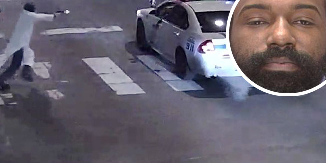 A still image from surveillance video shows a gunman (L) approaching a Philadelphia Police vehicle in which Officer Jesse Hartnett was shot shortly before midnight January 7, 2016 in Philadelphia, Pennsylvania this Philadelphia Police Department image released on January 8, 2016. A gunman claiming to have pledged allegiance to Islamic State militants shot and seriously wounded a Philadelphia police officer in an ambush on his patrol car, the city's police commissioner said on Friday.  REUTERS/Philadelphia Police Department/Handout  ATTENTION EDITORS - FOR EDITORIAL USE ONLY. NOT FOR SALE FOR MARKETING OR ADVERTISING CAMPAIGNS. THIS IMAGE HAS BEEN SUPPLIED BY A THIRD PARTY. THIS PICTURE WAS PROCESSED BY REUTERS TO ENHANCE QUALITY. AN UNPROCESSED VERSION WILL BE PROVIDED SEPARATELY  TPX IMAGES OF THE DAY