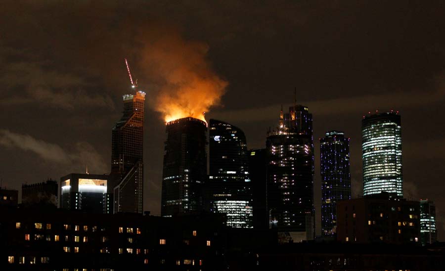 Fire is seen atop an under-construction skyscraper, planned to be Europe's tallest building, in Moscow, Russia, Monday, April 2, 2012. Orange flames were leaping about 250 meters (880 feet) Monday, visible in the night sky to much of the city. No injuries have been reported at the fire in the eastern tower of the Federation Tower complex, part of a massive development along the Moscow River about 2.5 kilometers (1.5 miles) west of the Kremlin. The tower, when completed, is to be 360 meters (1150 feet) tall. (AP Photo/Ivan Sekretarev)
