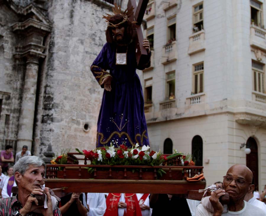 Catholics carry a statue of Jesus Christ during a Holy Week procession on Good Friday in Havana, Cuba, Friday April 6, 2012. Good Friday was an official holiday in Cuba for the first time in a half century, but few Roman Catholics on the island seemed to be using the day off to attend Mass. (AP Photo/Franklin Reyes)