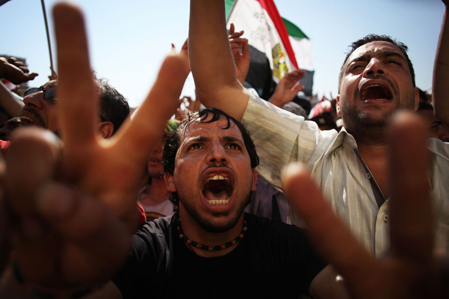 Egyptians celebrate the victory of Mohammed Morsi in the presidential election in Tahrir square, Cairo, Egypt, Sunday, June 24, 2012. Mohammed Morsi was declared Egypt's first Islamist president on Sunday after the freest elections in the country's history, narrowly defeating Hosni Mubarak's last Prime Minister Ahmed Shafiq in a race that raised political tensions in Egypt to a fever pitch. (AP Photo/Manu Brabo)