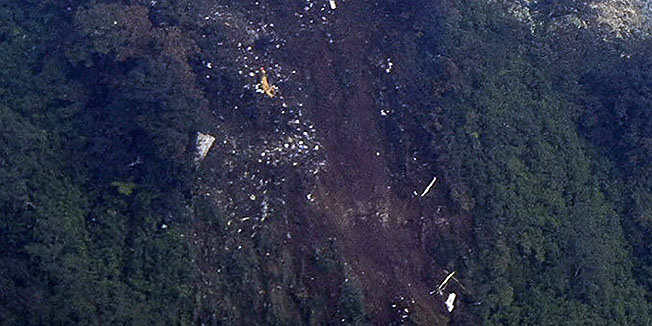 In this picture released by Indonesian Air Force,  the wreckage of a missing Sukhoi Superjet-100 are scattered on the mountainside in Bogor, West Java, Indonesia, Thursday, May 10, 2012. The new Russian-made passenger plane disappeared Wednesday during a demonstration flight with 47 people on board. (AP Photo/Indonesian Air Force)