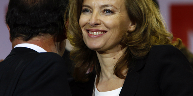 French president-elect Francois Hollande, left, turns back as his companion Valerie Trierweiler smiles after greeting supporters gathered to celebrate his election victory in Bastille Square in Paris, France, Sunday, May 6, 2012. France handed the presidency Sunday to leftist  Hollande, a champion of government stimulus programs who says the state should protect the downtrodden - a victory that could deal a death blow to the drive for austerity that has been the hallmark of Europe in recent years. (AP Photo/Francois Mori)