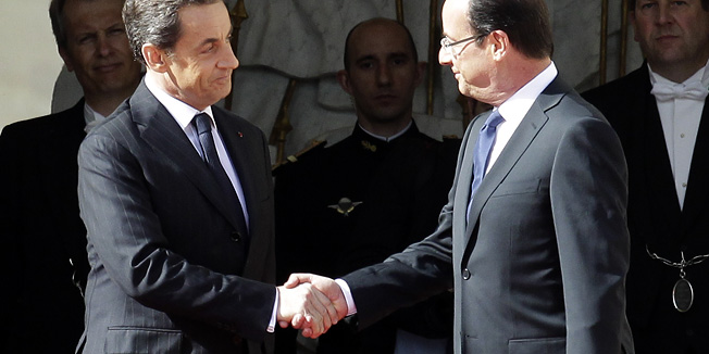 Outgoing French President Nicolas Sarkozy, left, welcomes President-elect President Francois Hollande before the handover ceremony, Tuesday, May 15, 2012 in Paris.  (AP Photo/Michel Euler)