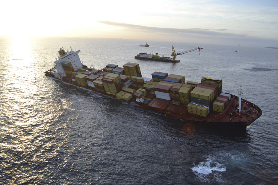In this Dec. 9, 2011, photo provided by Maritime New Zealand, the cargo ship Rena is hard aground after running full-steam into a well-charted reef off the coast near Tauranga, New Zealand on a calm night on Oct. 5.Australian inspection records show that a cargo ship that ran aground off New Zealand in October had previous safety issues. (AP Photo/Maritime New Zealand, Graeme Brown) EDITORIAL USE ONLY