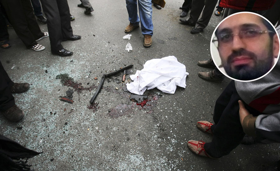 In this photo provided by the semi-official Fars News Agency, people gather around shattered glass and human remains in Tehran, Iran, Wednesday, Jan. 11, 2012. Two assailants on a motorcycle attached magnetic bombs to the car of an Iranian university professor working at a key nuclear facility, killing him and wounding two people on Wednesday, a semiofficial news agency reported. (AP Photo/Fars News Agency, Meghdad Madadi)