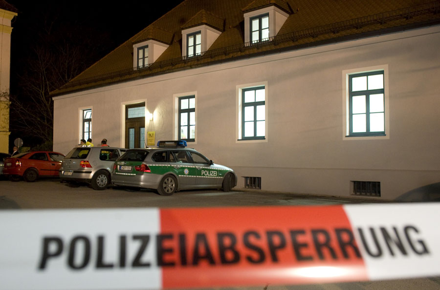 Police cars stand in front of the court in Dachau, southern Germany, Wednesday, Jan. 11, 2012. German police say a 54-year-old defendant shot and killed a prosecutor during his trial in the Munich area. Police spokesman Guenther Beck said the man opened fire Wednesday afternoon in the Dachau administrative court trial. The alleged shooter was on trial over claims he paid his employees improper wages. (AP Photo/dapd, Lennart Preiss)