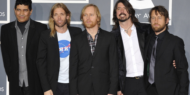 The Foo Fighters pose at the Staples Center for the 54th Grammy Awards in Los Angeles, California, February 12, 2012. AFP PHOTO  Joe KLAMAR