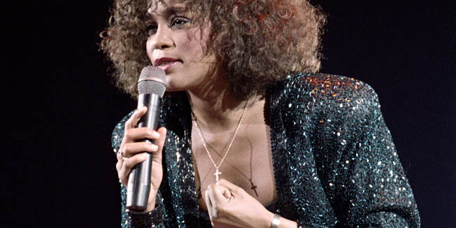 (FILES) A file picture taken on May 18, 1988 in Paris shows US singer Whitney Houston performing at the POPB (Bercy hall). Grammy-winning pop legend and actress Whitney Houston, 48, was found dead on February 11, 2012 in a Beverly Hills hotel, police said. AFP PHOTO BERTRAND GUAY