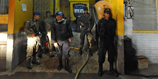 Army and police personnel stand guard at  the National Prison of Comayagua where at least 200 prisioners were killed and scores injured when fire tore through the prison in central Honduras, the Central American country's prisons director said. The prison held around 850 prisoners.   AFP PHOTO Orlando SIERRA