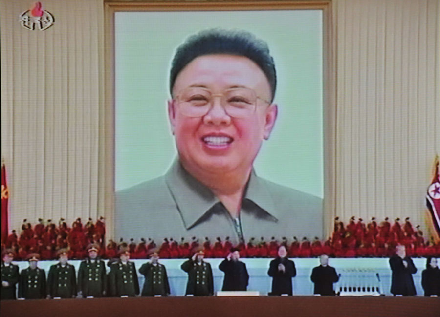 This TV grab taken off North Korea's state television shows  the picture of late leader Kim Jong-Il at Pyongyang's Kumsusan Memorial Palace during a military parade on February 16, 2012 to mark the birthday of late leader Kim Jong-Il.  North Korea's military paraded to mark the birthday of late leader Kim Jong-Il, pledging to defend his son and successor Jong-Un with their lives and crush enemy forces if attacked.   ---EDITORS NOTE --- RESTRICTED TO EDITORIAL USE - MANDATORY CREDIT 