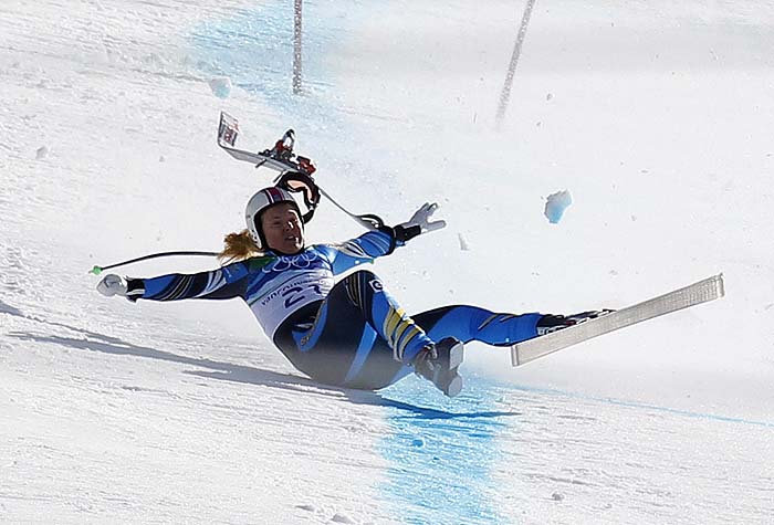 Anja Paerson of Sweden crashes into the finish following her run in the women's Alpine Skiing Downhill race at the Vancouver 2010 Winter Olympics in Whistler, British Columbia, February 17, 2010.   REUTERS/Mike Segar   (CANADA - Tags: SPORT OLYMPICS SKIING)