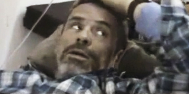 On this Thursday, Feb. 22, 2012 file image from amateur video made available by Shaam News Network purports to show Paul Conroy of the Sunday Times, laying wounded, in a makeshift clinic in Homs, Syria. Two activist groups said on Tuesday, Feb. 28, 2012, that Conroy has been smuggled to neighboring Lebanon.  The Syrian opposition group Local Coordination Committees and global group Avaaz said that Paul Conroy was the only foreign journalist to escape to Lebanon. American Marie Colvin and Frenchman Remi Ochlik were killed in the same attack and their bodies are still in Syria. (AP Photo/Shaam News Network via Associated Press Television News) THE ASSOCIATED PRESS CANNOT INDEPENDENTLY VERIFY THE CONTENT, DATE, LOCATION OR AUTHENTICITY OF THIS MATERIAL.