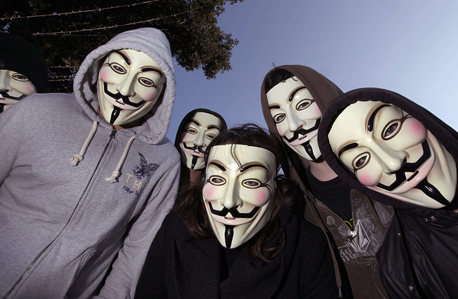 Protesters wearing Anonymous Guy Fawkes masks pose during a demonstration against controversial Anti-Counterfeiting Trade Agreement (ACTA), on February 25, 2012 in Nice, southeastern France. AFP PHOTO / VALERY HACHE