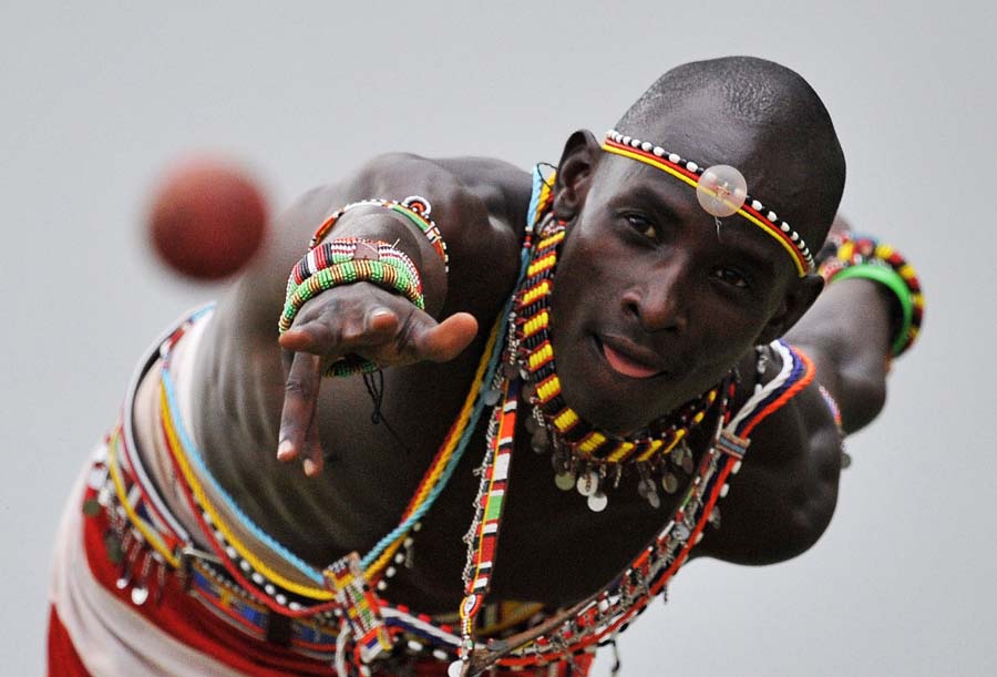 A bowler in the Maasai Warriors cricket team throws the ball during pratice at a cricket grounds in Mombasa, South East Kenya on March 5, 2012. The team is made up of Maasai warriors from the Laikipia region of Kenya. The players are aiming to be role models in their communities where they are actively campaigning against FGM (Female Genital Mutilation), early childhood marriages and are fighting for the rights of women. Through playing and being involved in cricket activities in regional communities they are trying to promote healthier lifestyles and spreading awareness about HIV/AIDS amongst tribal youth. The team have been invited to play in the Last Man Stands Twenty20 Championship in Cape Town, South Africa. AFP PHOTO/Carl de Souza